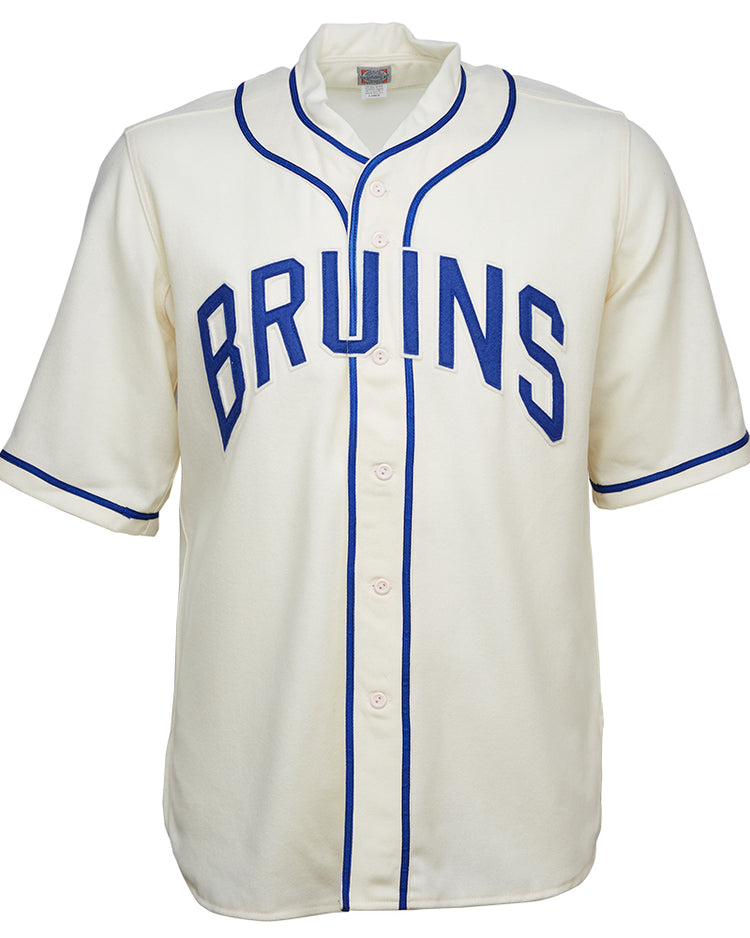 The EFF UCLA 1940 Home Jersey is a white vintage wool flannel with blue piping and BRUINS in bold blue across the chest. It features front buttons and short sleeves, faithfully replicating the original classic baseball look.