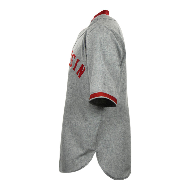 Side view of a vintage gray EFF University of Wisconsin 1930 Road Jersey with red collar and sleeve trim, featuring partial red chest lettering—an authentic flannel reproduction.
