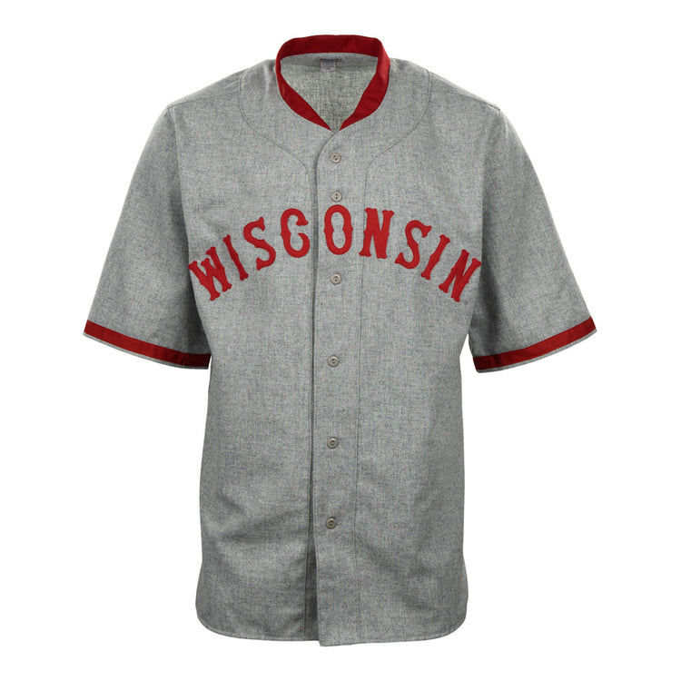 The EFF University of Wisconsin 1930 Road Jersey is a gray button-up with red collar and sleeve trim, featuring WISCONSIN in bold red letters on the chest—a classic Badgers baseball style authentic reproduction.