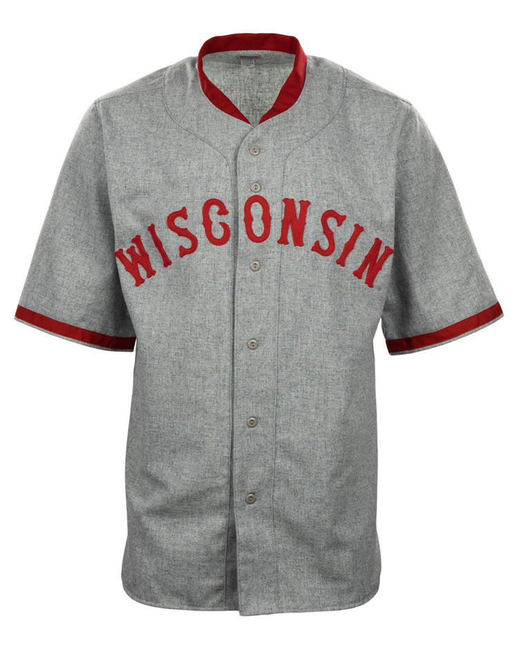 The EFF University of Wisconsin 1930 Road Jersey is a gray button-up with red collar and sleeve trim, featuring WISCONSIN in bold red letters on the chest—a classic Badgers baseball style authentic reproduction.