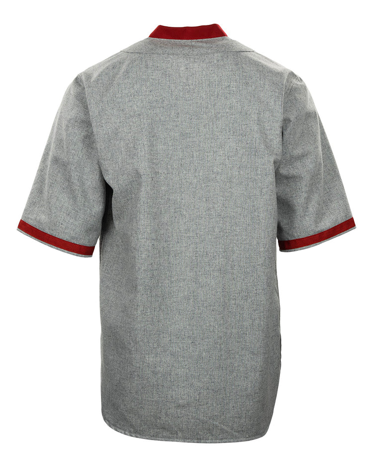 Back view of the EFF University of Wisconsin 1930 Road Jersey, a short-sleeved gray shirt with dark red trim on the collar and cuffs, featuring a straight hem and no visible patterns or logos. Inspired by an authentic 1930 Badgers Baseball jersey.