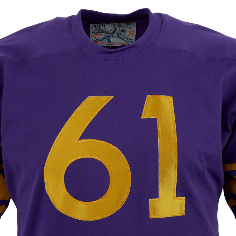 A close-up of the EFF University of Washington 1970 Durene Football Jersey in purple, featuring large yellow 61 on the front, partially visible collar tag, and classic yellow sleeve stripes.