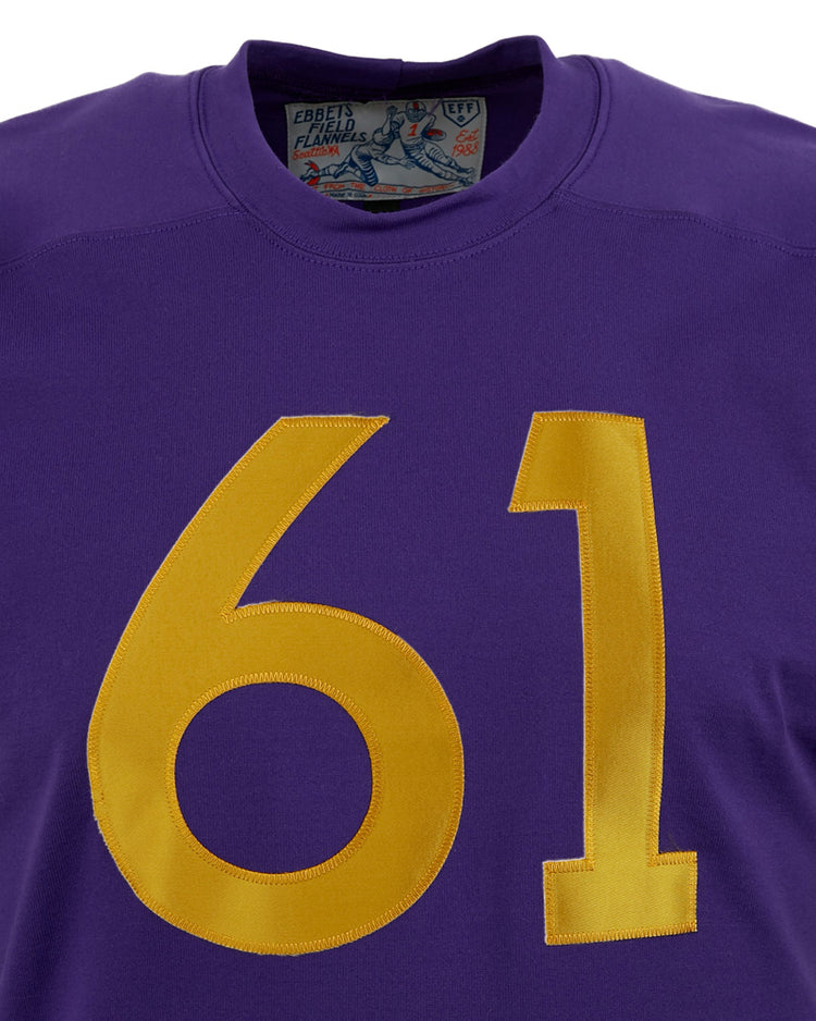 A close-up of the EFF University of Washington 1970 Durene Football Jersey in purple, featuring large yellow 61 on the front, partially visible collar tag, and classic yellow sleeve stripes.