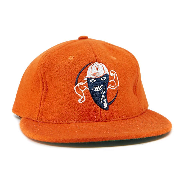 The EFF Victoria Mussels 1979 Vintage Ballcap is an orange cap with an embroidered smiling character—blue face mask, flexed arms, and a white cap featuring a red V on the front.