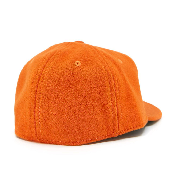 The EFF Victoria Mussels 1979 Vintage Ballcap in orange features a textured, fleece-like material and is pictured from the back with the bill facing away.