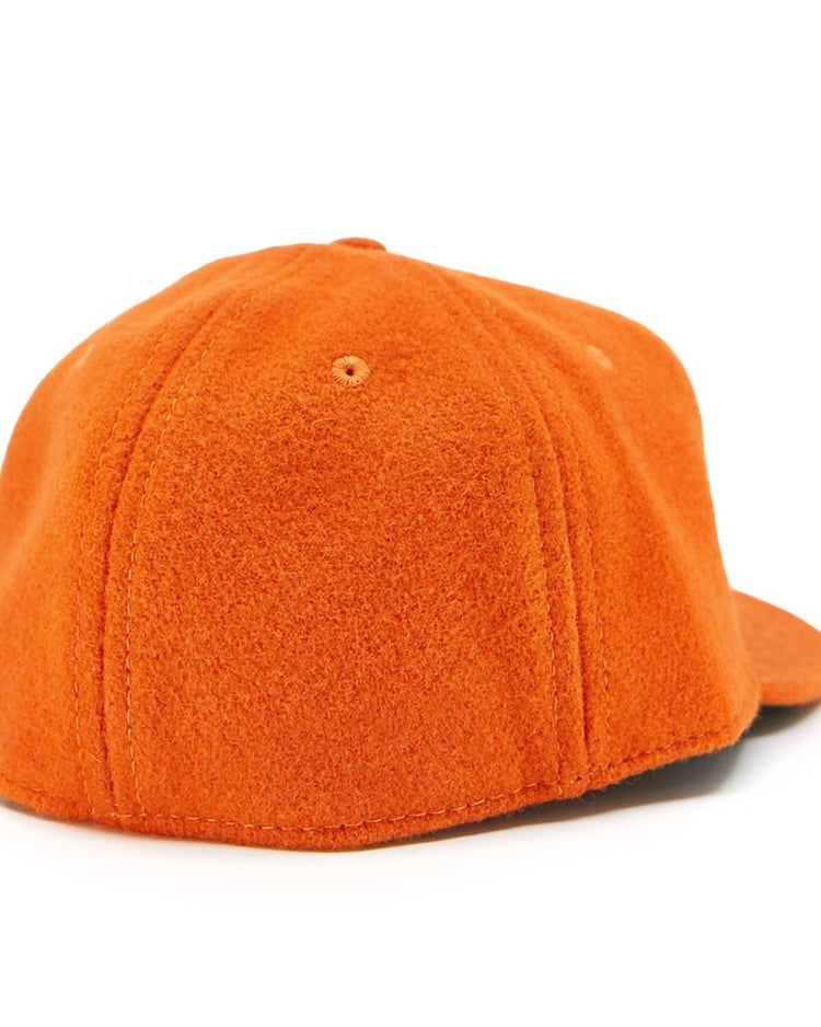 The EFF Victoria Mussels 1979 Vintage Ballcap in orange features a textured, fleece-like material and is pictured from the back with the bill facing away.