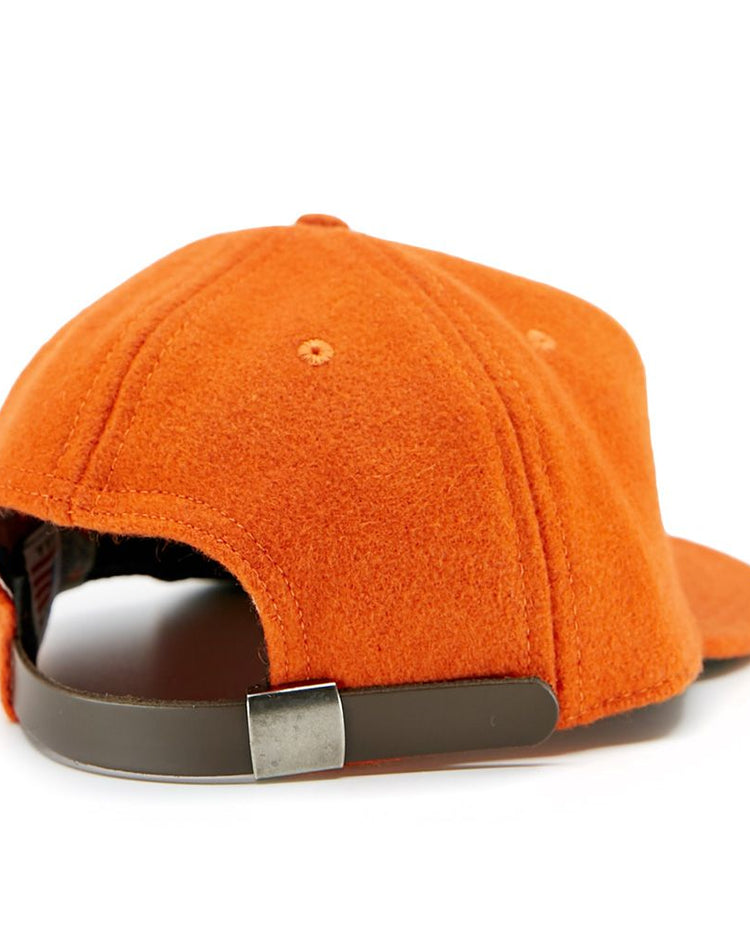 The EFF Victoria Mussels 1979 Vintage Ballcap is shown from the back, featuring orange genuine wool and a brown adjustable strap with a silver buckle for a classic look.