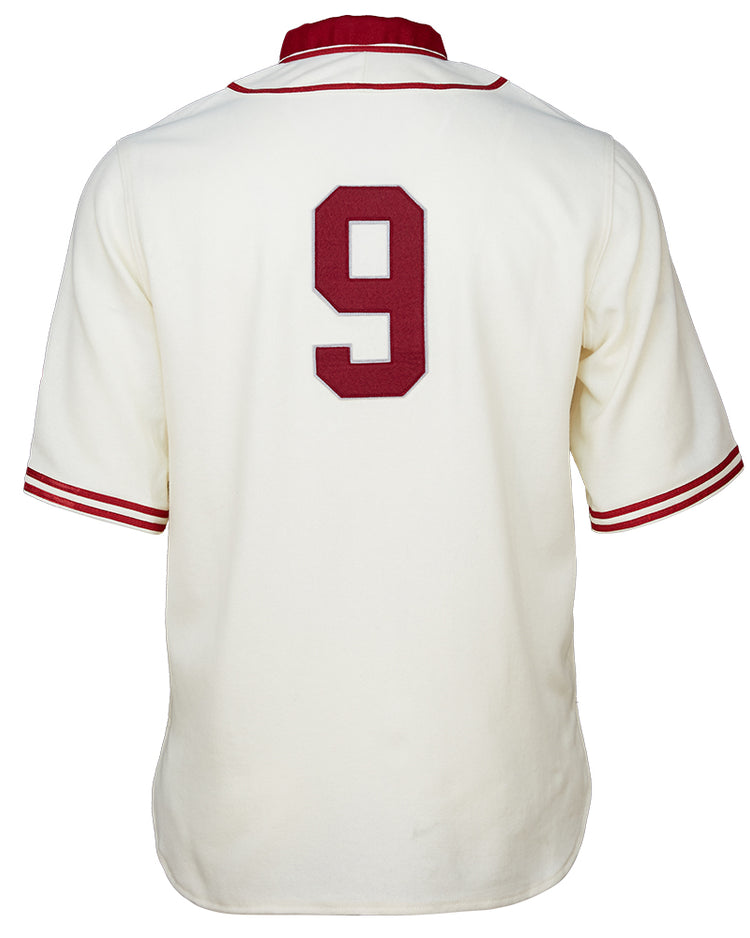 The EFF Washington State University 1937 Home Jersey is a white baseball jersey with red sleeve and collar trim, featuring a large red number 9 on the back—an authentic vintage reproduction for Cougars fans.