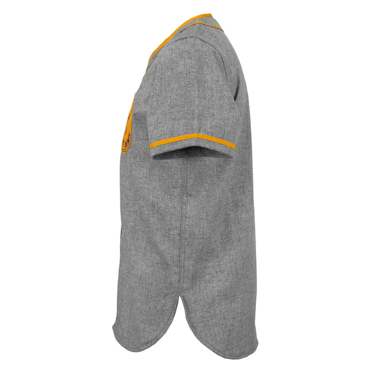 Side view of the EFF Hoboken Young Democrats 1972 Road Jersey, a short-sleeved gray button-up shirt with yellow trim on the collar and cuffs, vintage baseball style, curved hem, and a partially visible chest emblem.