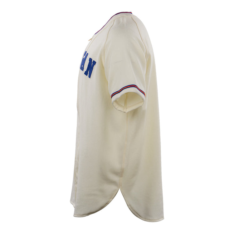 The EFF Morgan State University 1975 Home Jersey is a cream short-sleeve authentic reproduction featuring blue chest lettering and red-blue striped sleeve cuffs, inspired by the original 1975 design.