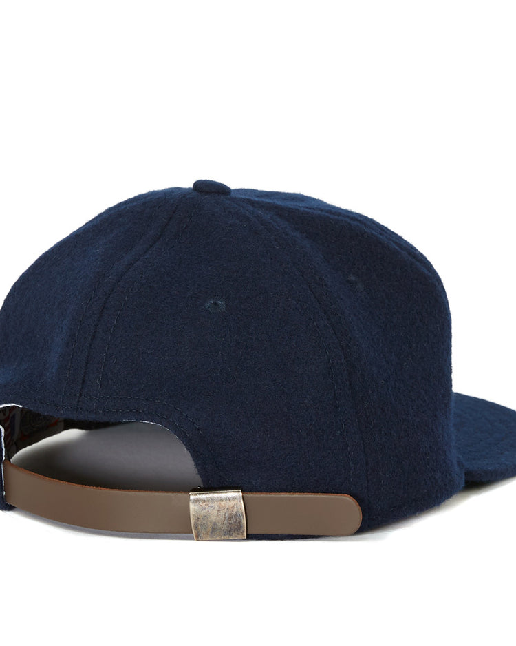 The EFF Southern University 1969 Vintage Ballcap is a navy wool cap inspired by the original, shown from the back with a brown leather adjustable strap and silver clasp.